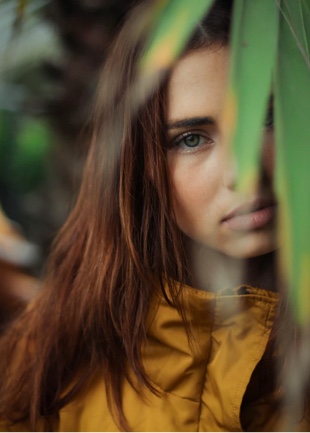 an image of willow, the writer of this blog, who is a young woman with brown hair and wearing a yellow rain jacket 
